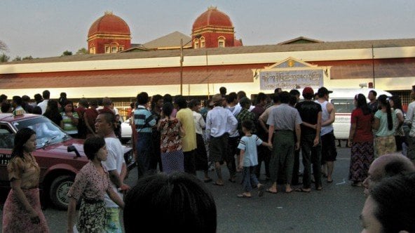 people wait for their relatives in front of an emergency at yangon general hospital after the blasts afp