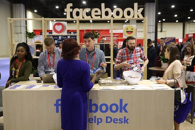 attendees visit the facebook help desk inside the conservative political action conference hub at the gaylord national resort and convention center february 23 2018 in national harbor maryland photo afp