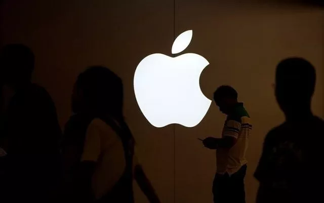 a man looks at the screen of his mobile phone in front of an apple logo outside its store in shanghai china july 30 2017 photo reuters a man looks at the screen of his mobile phone in front of an apple logo outside its store in shanghai china july 30 2017 photo reuters