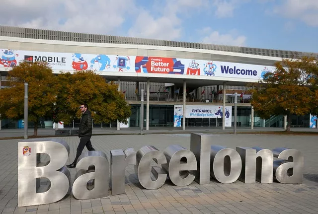a man walks past a typeface sculpture in front of an entrance of the mobile world congress in barcelona spain february 22 2018 photo reuters a man walks past a typeface sculpture in front of an entrance of the mobile world congress in barcelona spain february 22 2018 photo reuters