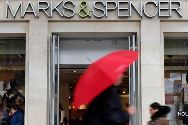 pedestrians walk past a marks amp spencer store on the champs elysees avenue in paris france november 8 2016 photo reuters pedestrians walk past a marks amp spencer store on the champs elysees avenue in paris france november 8 2016 photo reuters