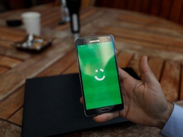 an employee shows the logo of ride hailing company careem on his mobile in his office in the west bank city of ramallah july 17 2017 photo reuters