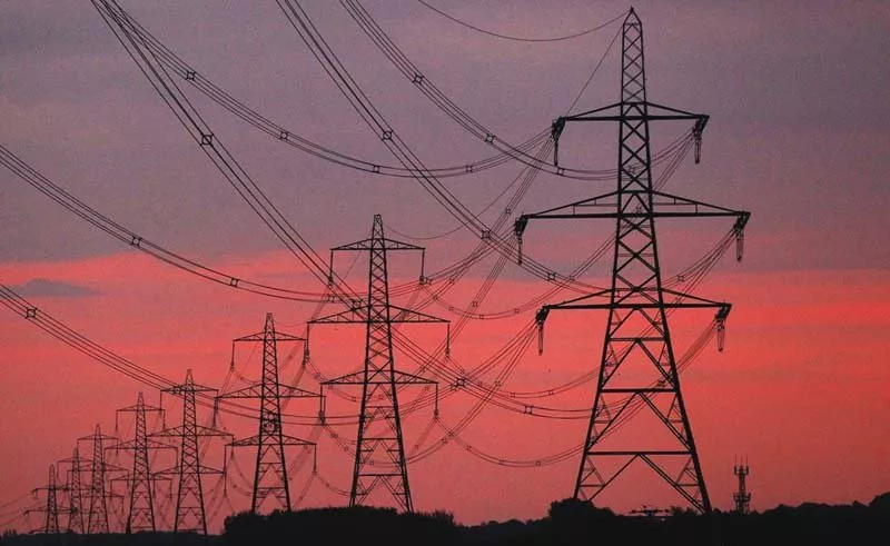 the sun rises behind electricity pylons photo reuters the sun rises behind electricity pylons photo reuters