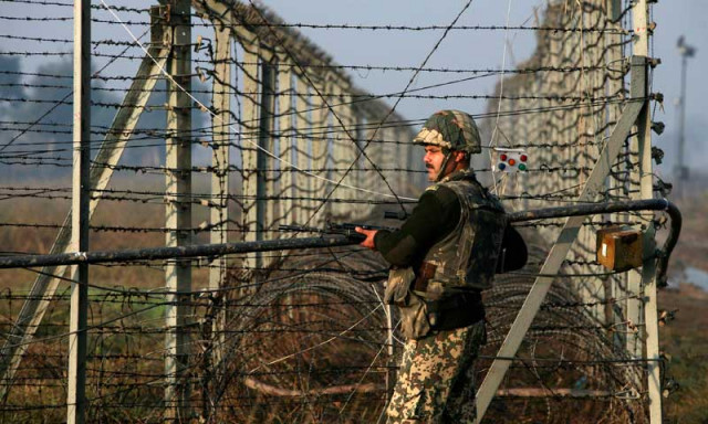 an indian border security force bsf soldier patrols near the fenced border with pakistan in suchetgarh southwest of jammu january 11 2013 photo reuters an indian border security force bsf soldier patrols near the fenced border with pakistan in suchetgarh southwest of jammu january 11 2013 photo reuters