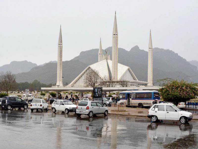 vehicles of picnickers seen parked near faisal mosque photo inp