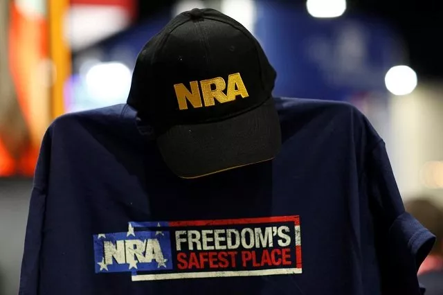 a cap and shirt are displayed at the nra booth at the conservative political action conference at national harbor maryland us february 23 2018 photo reuters a cap and shirt are displayed at the nra booth at the conservative political action conference at national harbor maryland us february 23 2018 photo reuters
