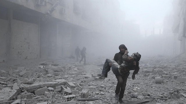 a wounded man is carried following an air strike on the rebel held besieged town of arbin in the eastern ghouta region on the outskirts of the capital damascus on january 2 2018 photo reuters