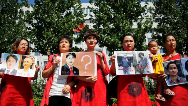 relatives of detained rights lawyers and activists protest in front of the supreme people s procuratorate in beijing july 7 2017 photo reuters relatives of detained rights lawyers and activists protest in front of the supreme people s procuratorate in beijing july 7 2017 photo reuters