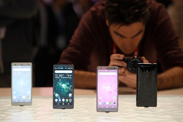 a man takes pioctures of sony xperia xz2 mobilephones at the mobile world congress mwc the world 039 s biggest mobile fair on february 26 2018 in barcelona the mobile world congress is held in barcelona from february 26 to march 1 photo afp