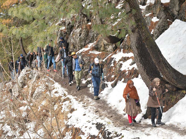 hikers move along a trail in nathiagali photo express hikers move along a trail in nathiagali photo express