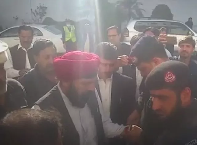 baldev kumar was escorted out of the k p assembly by the security officials screengrab baldev kumar was escorted out of the k p assembly by the security officials screengrab
