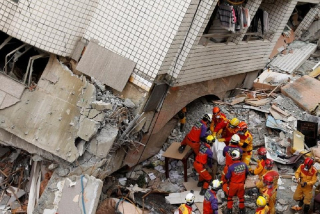 a body of a hong kong canadian is carried out from a collapsed building after an earthquake hit hualien taiwan february 9 2018 photo reuters file a body of a hong kong canadian is carried out from a collapsed building after an earthquake hit hualien taiwan february 9 2018 photo reuters file