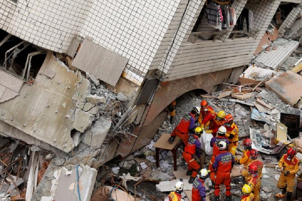 a body of a hong kong canadian is carried out from a collapsed building after an earthquake hit hualien taiwan february 9 2018 photo reuters file