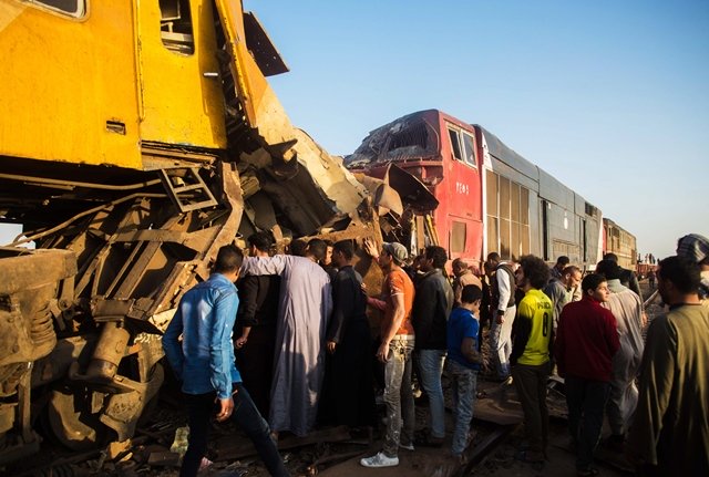 egyptians check the damage following a train crash in egypt 039 s northern beheira province on february 28 2018 at least 10 people were killed and 15 wounded when two trains collided in egypt the health ministry said photo afp
