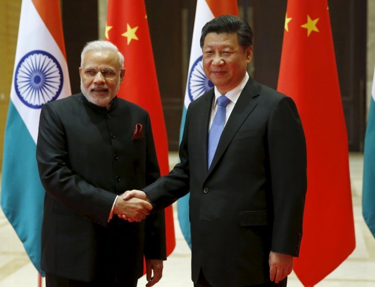 ndian prime minister narendra modi l and chinese president xi jinping shake hands before they hold a meeting in xian shaanxi province china may 14 2015 photo reuters file