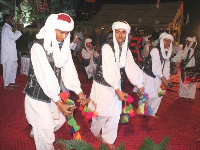 women children and men enjoyed the baloch dances and folk songs which were being played at the lyari football stadium in celebration of baloch day on march 4 2013 photo mohammed saqib express