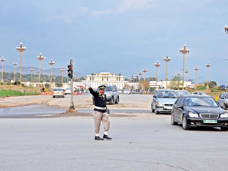 police officer controls the traffic at d chowk which opened to public after many years photo zafar aslam express