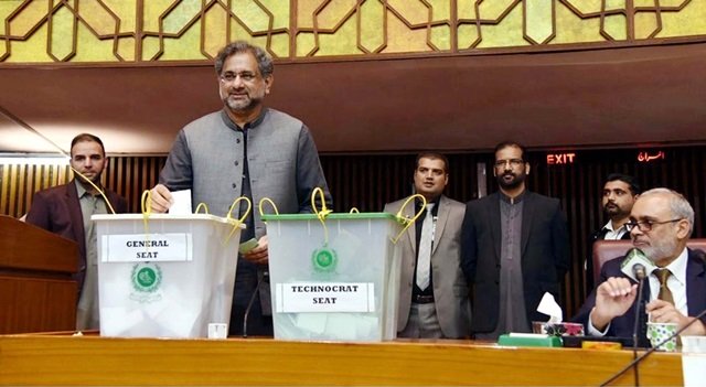 prime minister shahid khaqan abbasi casts his vote during senate election held at parliament house in islamabad on saturday photo ppi