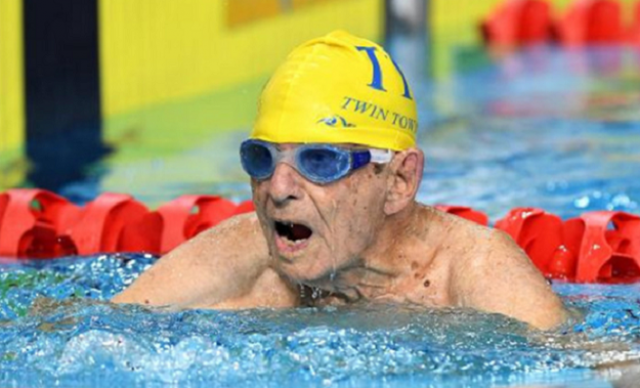 photo shows 99 year old george corones of australia who broke what is claimed to be the 50 meter long course freestyle world record for his age group photo afp