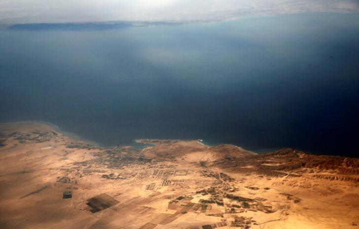 an aerial view of the coast of the red sea and the two islands of tiran and sanafir is pictured through the window of an airplane near sharm el sheikh egypt photo reuters