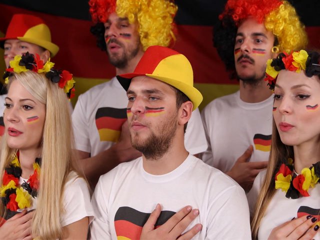 group of people singing german patriotic anthem video footage photo courtesy video blocks