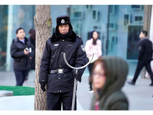 security personnel stand guard outside the joy city mall in the xidan district after a knife attack in beijing china feb 11 2018 photo reuters