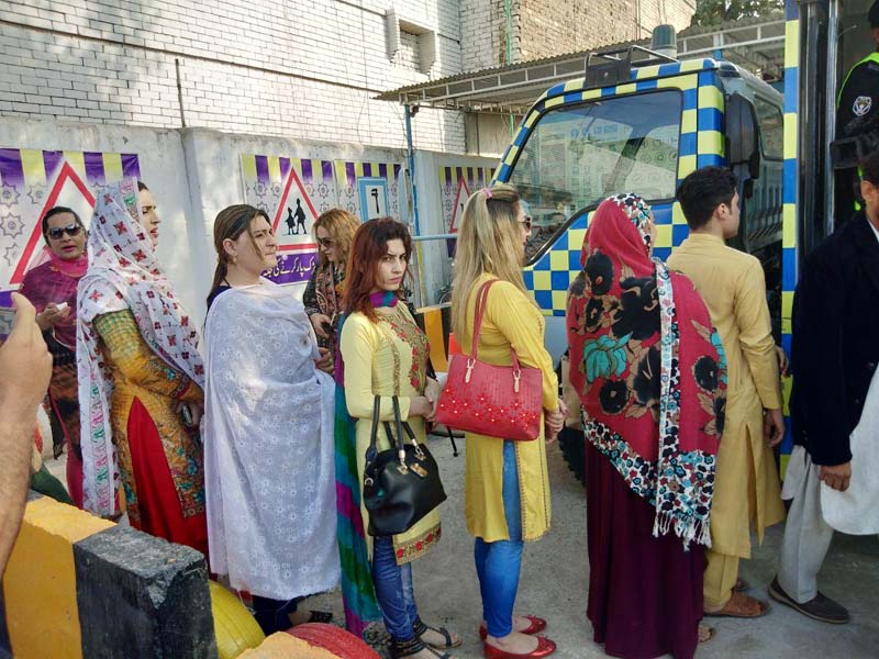 transgender persons line up in a queue waiting to process their driving licence documents in peshawar photo express