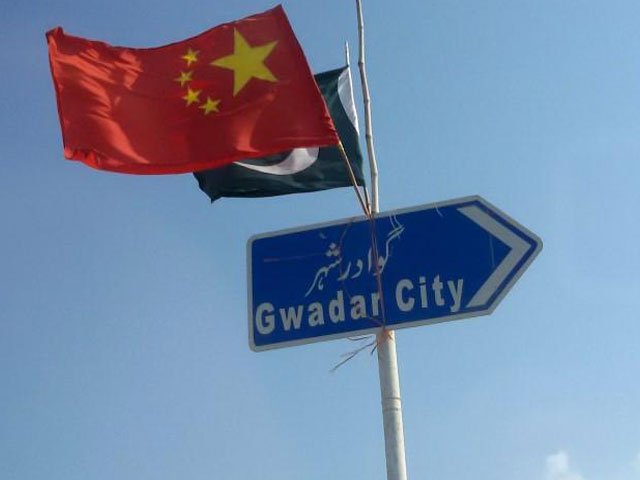 the chinese and pakistani flags fly on a sign along a road towards gwadar pakistan january 26 2016 photo reuters