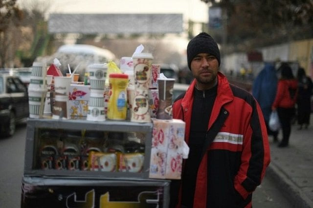 file photo of najibullah sharyari waiting for customers at his coffee cart in kabul january 8 2018 photo afp file file photo of najibullah sharyari waiting for customers at his coffee cart in kabul january 8 2018 photo afp file