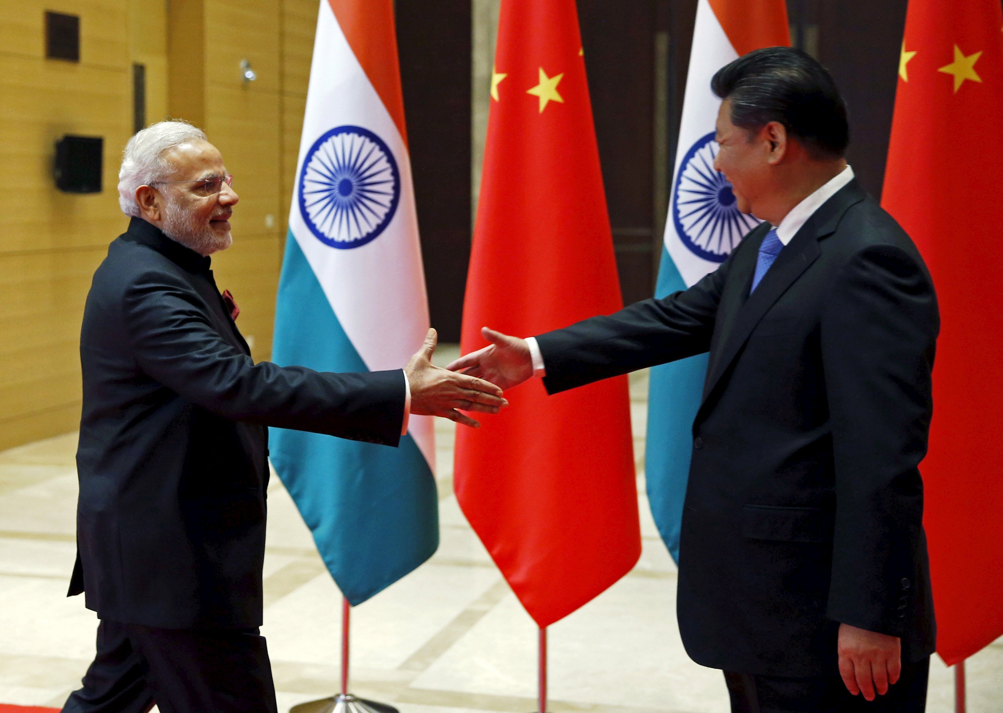 indian prime minister narendra modi and chinese president xi jinping shake hands before they hold a meeting in xian shaanxi province china photo reuters