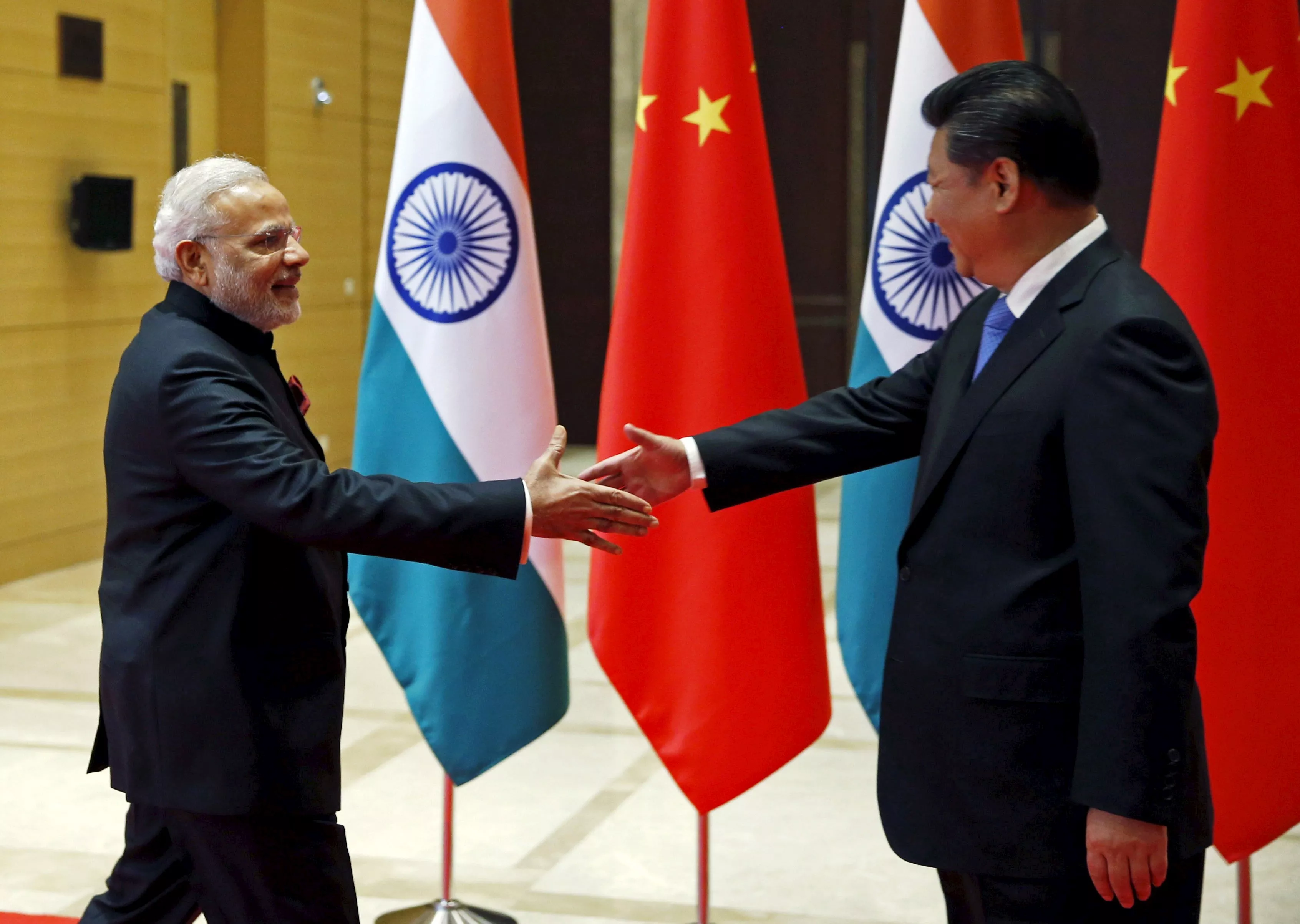 indian prime minister narendra modi and chinese president xi jinping shake hands before they hold a meeting in xian shaanxi province china photo reuters indian prime minister narendra modi and chinese president xi jinping shake hands before they hold a meeting in xian shaanxi province china photo reuters