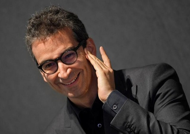 federico marchetti ceo of online clothing retailer yoox net a porter speaks during a news conference at the unveiling of the company tech hub premises at white city in london britain june 27 2017 photo reuters