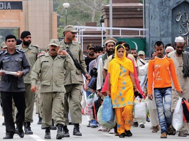 paramilitary rangers officials escort released pakistani prisoners after a handover by indian authorities at the wagah border post photo afp file paramilitary rangers officials escort released pakistani prisoners after a handover by indian authorities at the wagah border post photo afp file