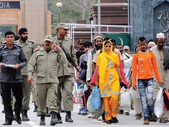 paramilitary rangers officials escort released pakistani prisoners after a handover by indian authorities at the wagah border post photo afp file paramilitary rangers officials escort released pakistani prisoners after a handover by indian authorities at the wagah border post photo afp file