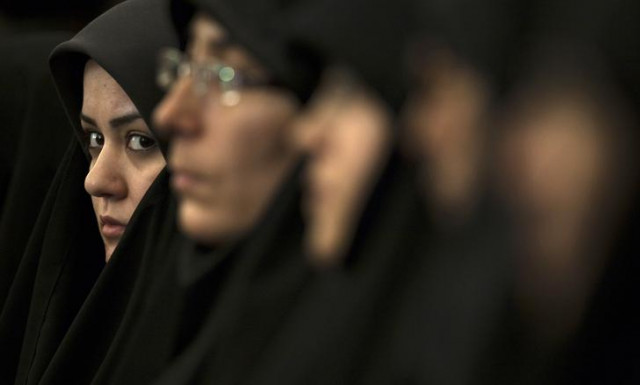 a religious activist looks on while attending the 25th international islamic unity conference in tehran february 8 2012 photo reuters a religious activist looks on while attending the 25th international islamic unity conference in tehran february 8 2012 photo reuters