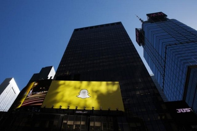 a billboard displays the logo of snapchat above times square in new york march 12 2015 photo reuters