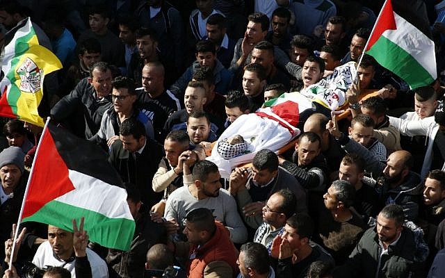 mourners carry the body of mohammed aqal a palestinian killed after carrying out a stabbing attack on a border police officer during his funeral in the west bank village of beit ula photo afp