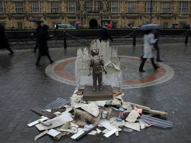 a life size statue of a child is pictured outside the houses of parliament in london on march 7 2018 as part of a protest photo afp