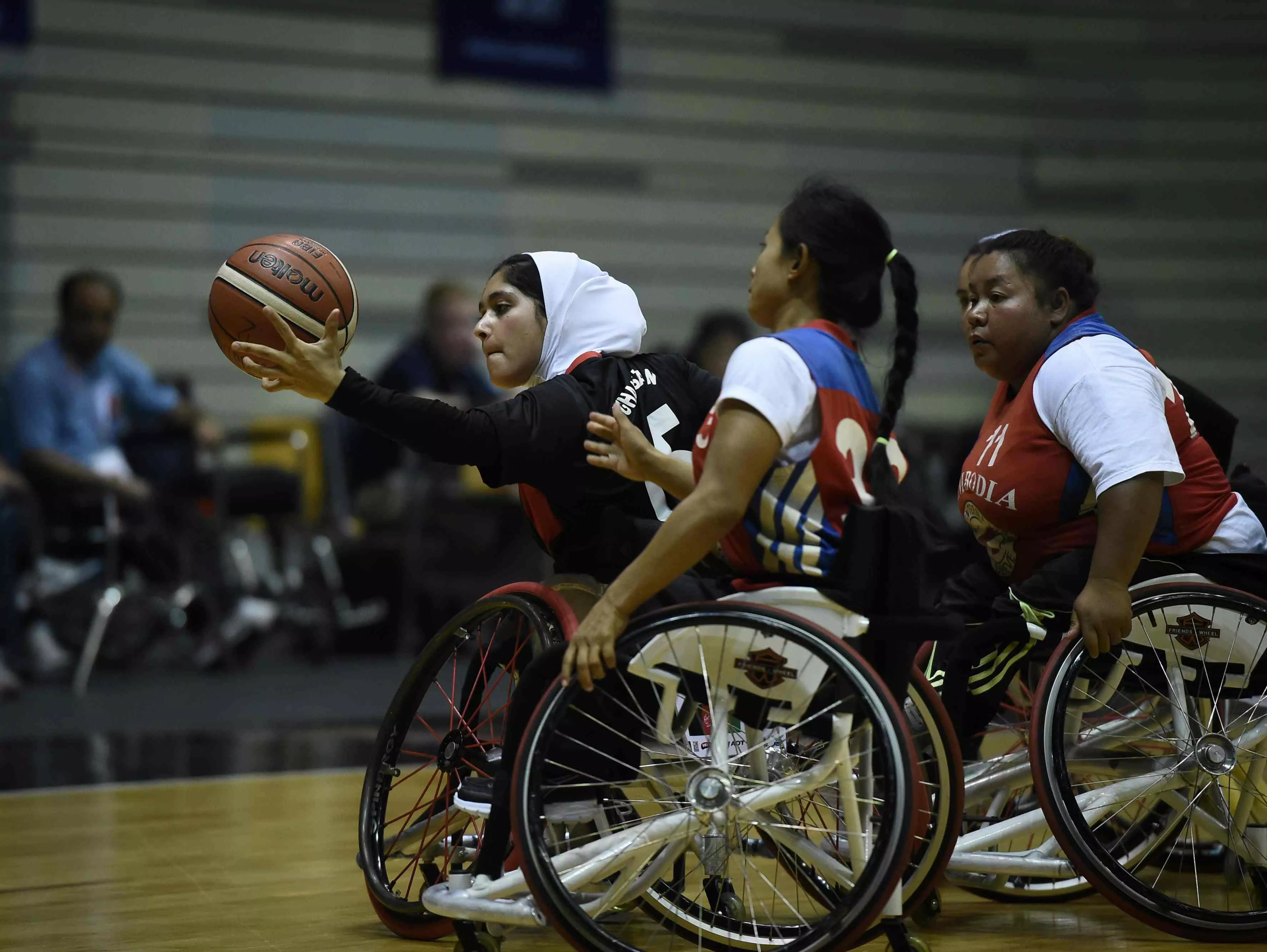 a member of afghanistan 039 s women 039 s wheelchair basketball team in black battles for the ball against cambodia during the qualifying tournament for the asia para games in bangkok photo afp a member of afghanistan 039 s women 039 s wheelchair basketball team in black battles for the ball against cambodia during the qualifying tournament for the asia para games in bangkok photo afp