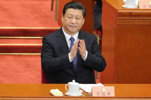 president xi jinping applauds during the opening session of the national people 039 s congress china 039 s legislature at the great hall of the people in beijing on march 5 2018 photo afp