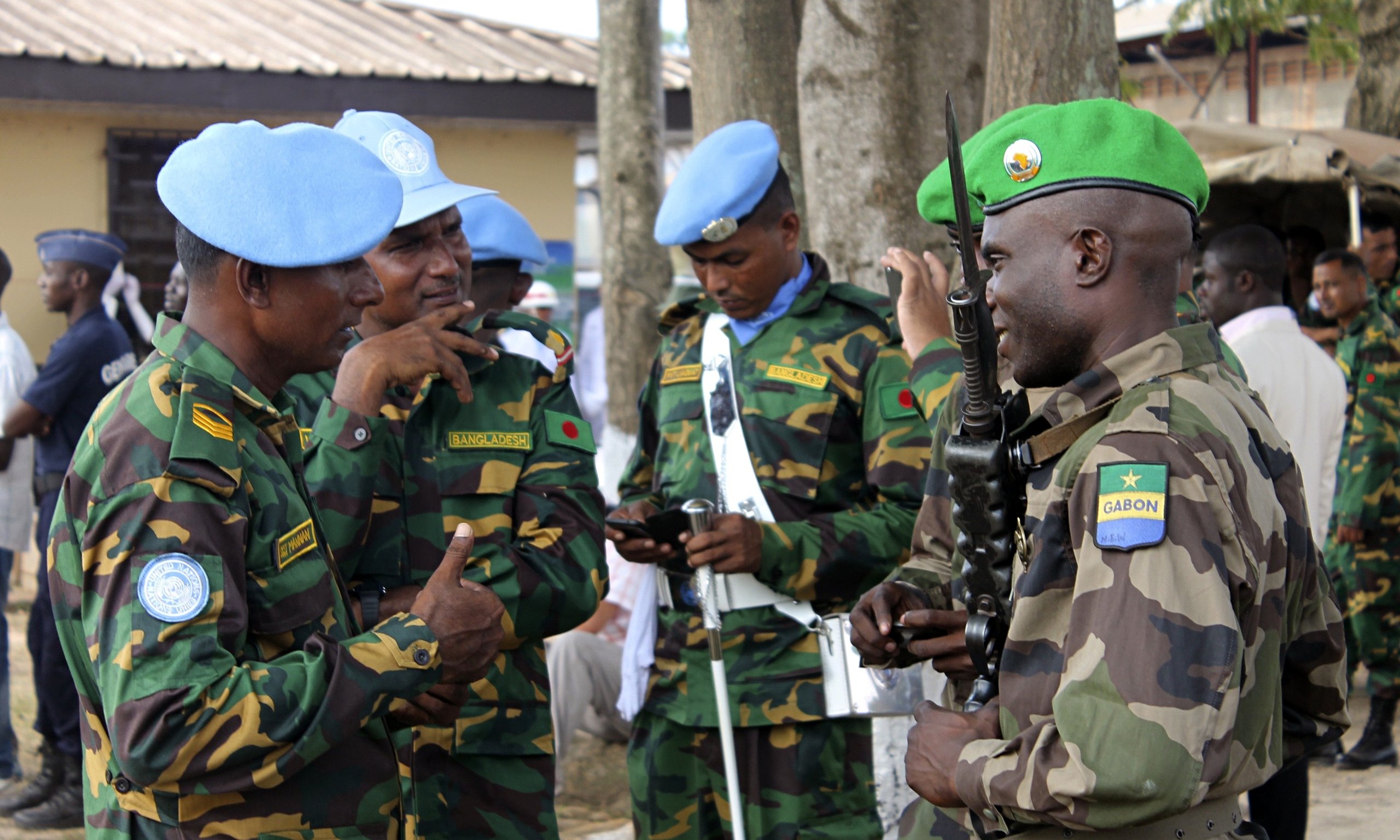 in this file photo gabonese soldiers from misca green berets speak to minusca soldiers blue berets in bangui central african republic photo afp