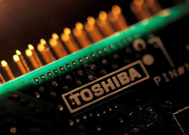 a logo of toshiba corp is seen on a printed circuit board in this photo illustration taken in tokyo july 31 2012 photo reuters