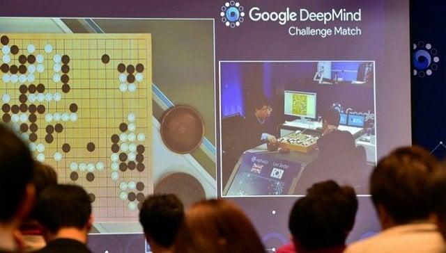 a group of journalists looks at a screen showing the progress of a go game between the deepmind system and lee se dol in seoul on march 12 2016 photo afp