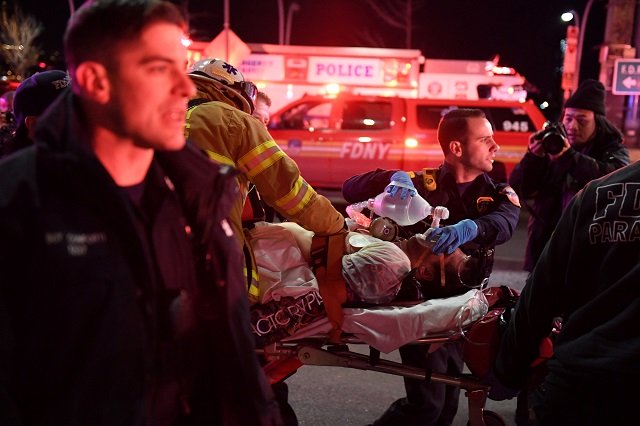 a reuters photographer witnessed three people recovered by rescue divers being wheeled on stretchers onto a midtown pier shortly before 9pm photo reuters