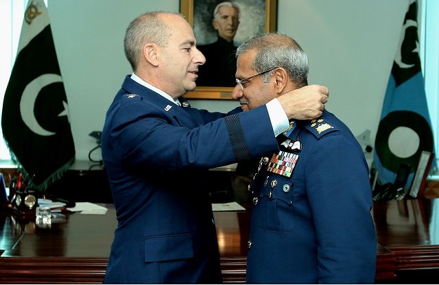 lt gen jeffrey l harrigian commander u s air forces central command confers the award to air chief marshal sohail aman chief of the air staff pakistan air force photo app