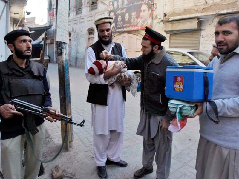 a health worker administers polio vaccine to a child in peshawar photo file