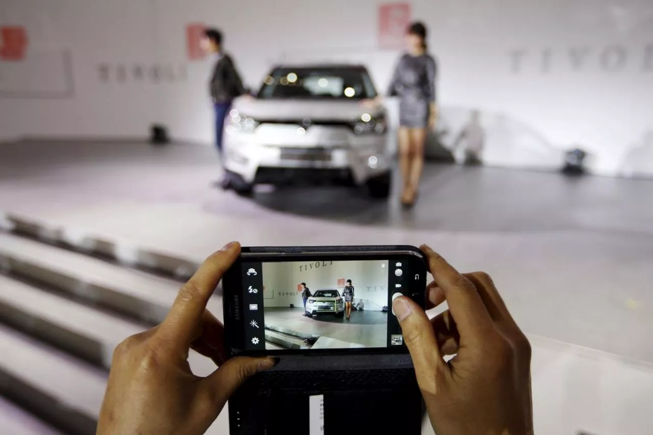 a man takes a photograph of ssangyong motor co 039 s tivoli during its launch ceremony in seoul in this january 13 2015 file photo photo reuters a man takes a photograph of ssangyong motor co 039 s tivoli during its launch ceremony in seoul in this january 13 2015 file photo photo reuters