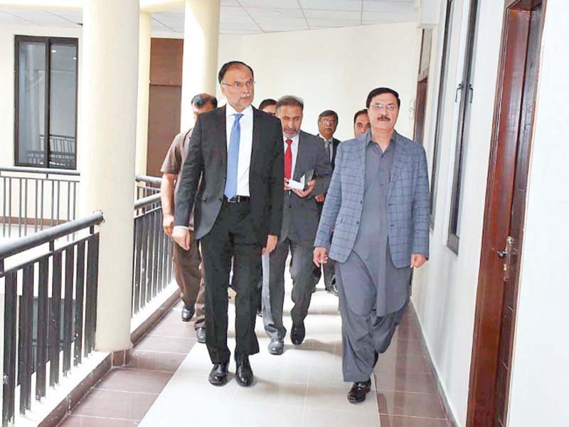 interior minister ahsan iqbal walks in the new building of nacta photo app