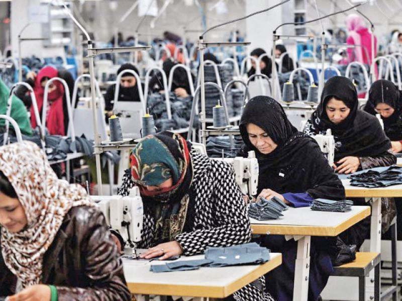 women working in a garment factory photo file