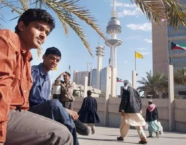 asian workers take a break after work at a park next to kuwait 039 s liberation tower photo afp file asian workers take a break after work at a park next to kuwait 039 s liberation tower photo afp file